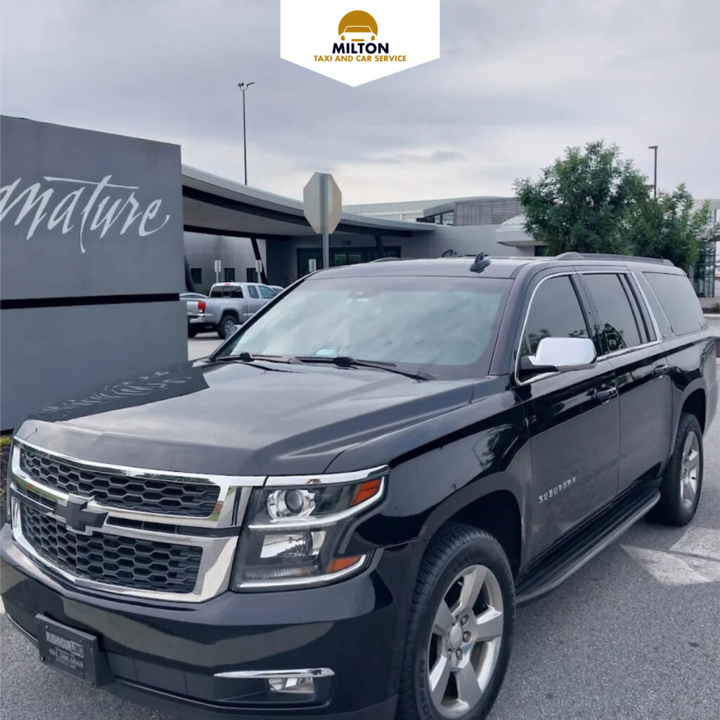Black Chevrolet Suburban providing professional airport and city transfers by Milton Taxi and Car Service.